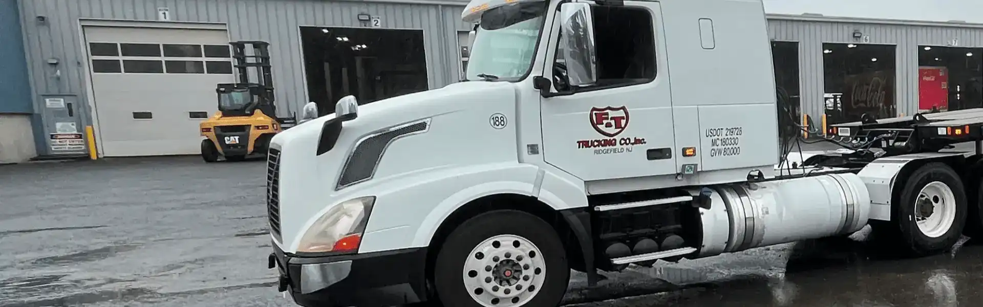A white truck with the company logo on it.